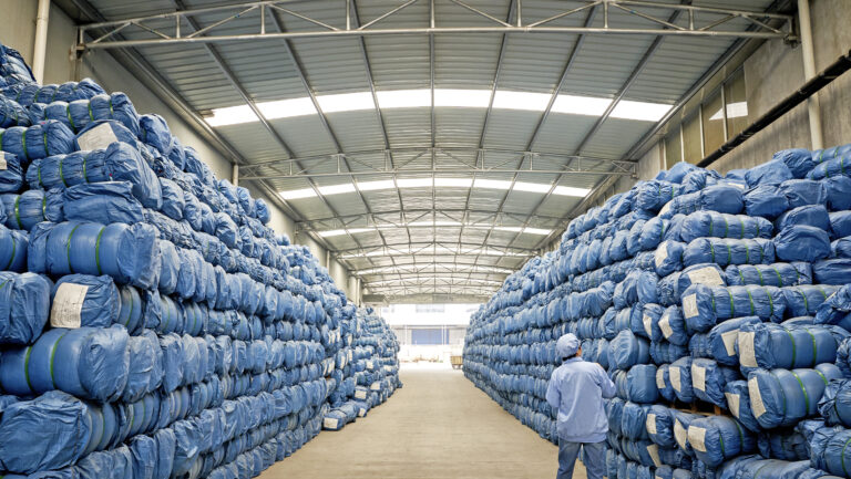 A warehouse full of mosquito nets showing volume guarantees in action