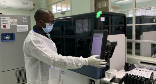 A lab technician using the Hologic Panther machine