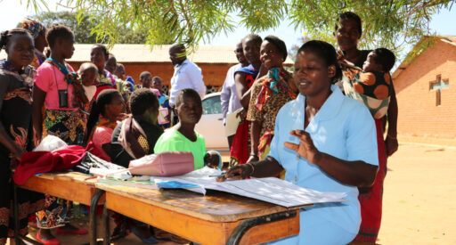 A health worker screens children to determine if they are eligible for the malaria vaccine, Mkaka Primary School Outreach, Malawi