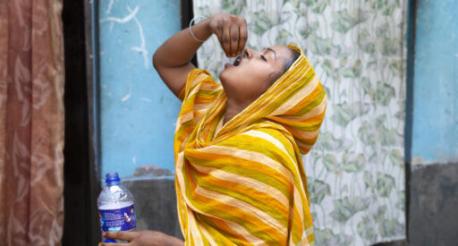 A patient takes her TB treatment at her home in Dhaka, Bangladesh