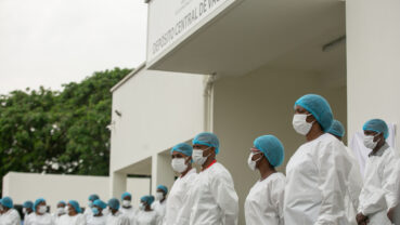 Health professionals line up to administer Angola's first COVID-19 vaccines on behalf of the COVAX facility