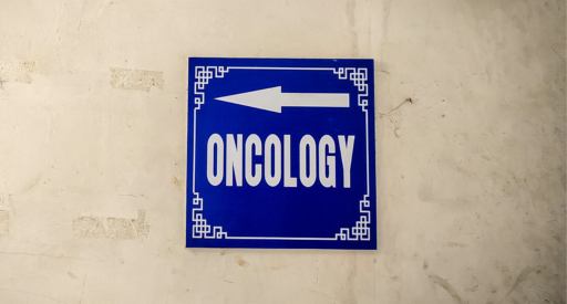 A blue sign with the word 'Oncology'